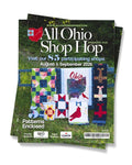 Magazine cover for 'All Ohio Shop Hop' with quilt designs on a grassy background