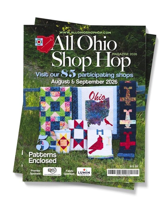 Magazine cover for 'All Ohio Shop Hop' with quilt designs on a grassy background