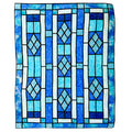 A square textile or rug featuring a stained-glass-inspired geometric pattern in shades of blue, light blue, white, and black outlines, shown flat against a plain white background.