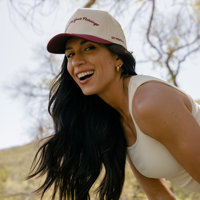 Show Me Your Piercings Trucker Hat in Berry