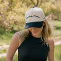 Show Me Your Piercings Trucker Hat in Black