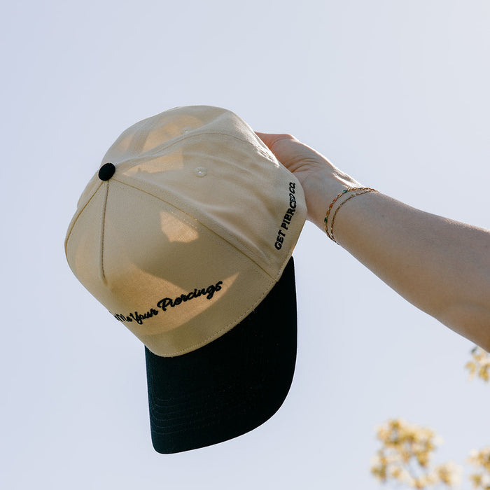 Show Me Your Piercings Trucker Hat in Black