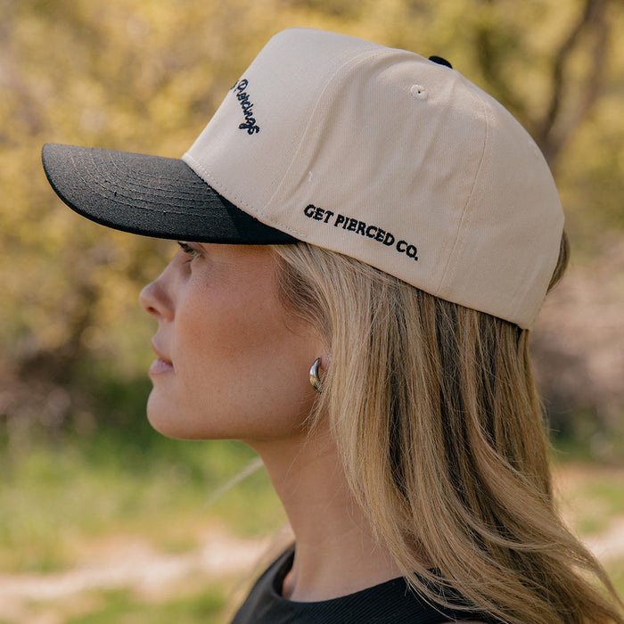 Show Me Your Piercings Trucker Hat in Black